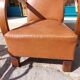 Low armchair, brown imitation leather