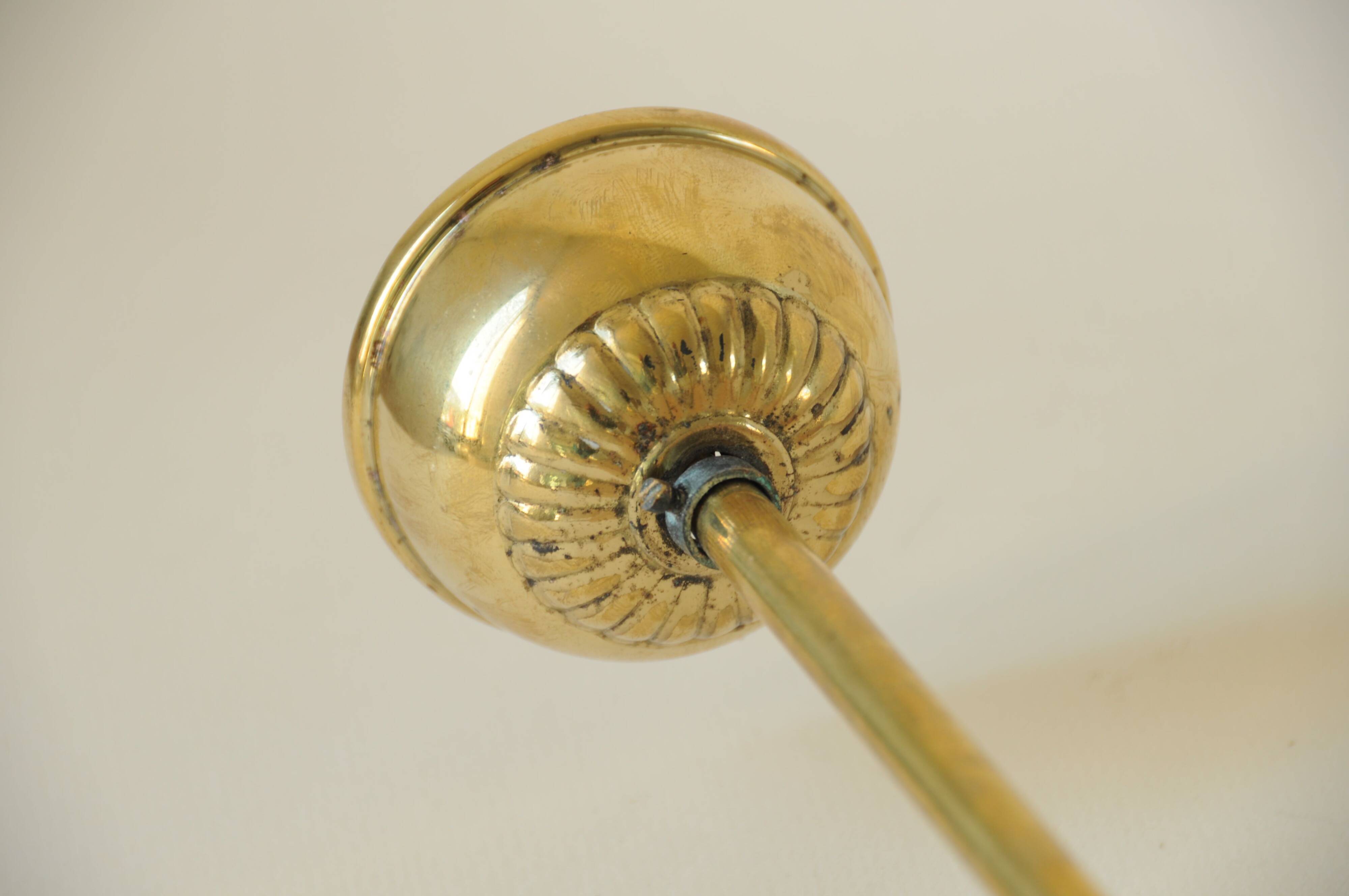 Mid century modernist pendant light in brass and textured glass ball