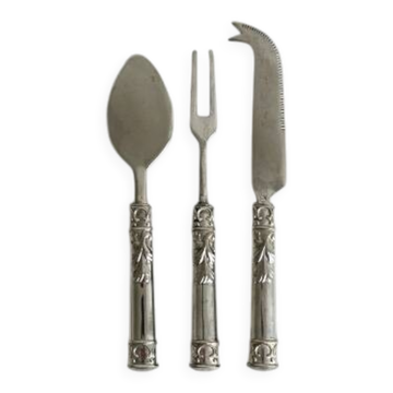 Antique shiny metal cheese cutlery