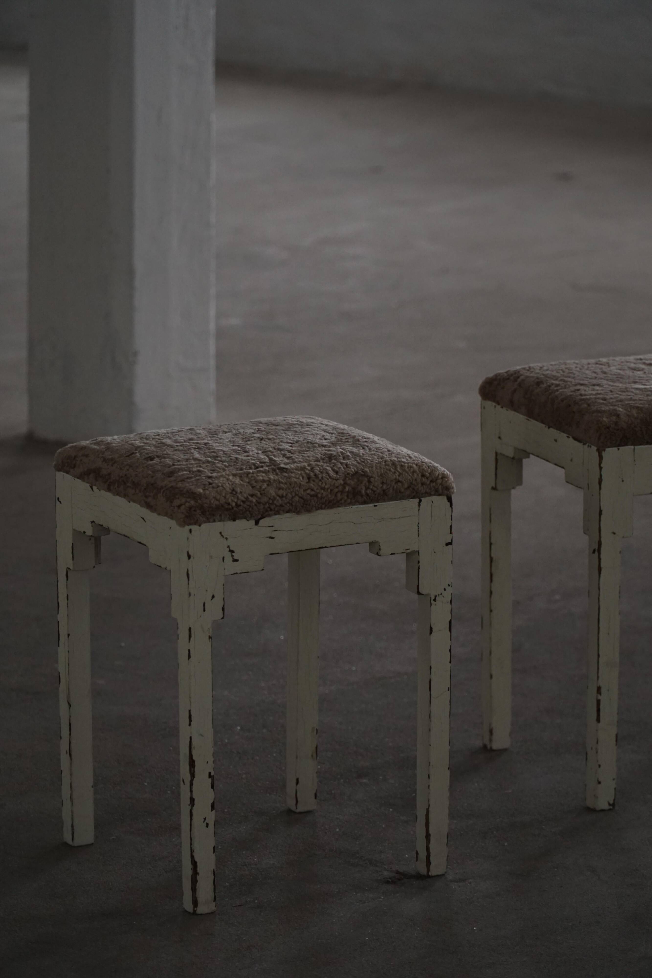 A pair of antique Danish stools, seats in lambswool, late 19th century.