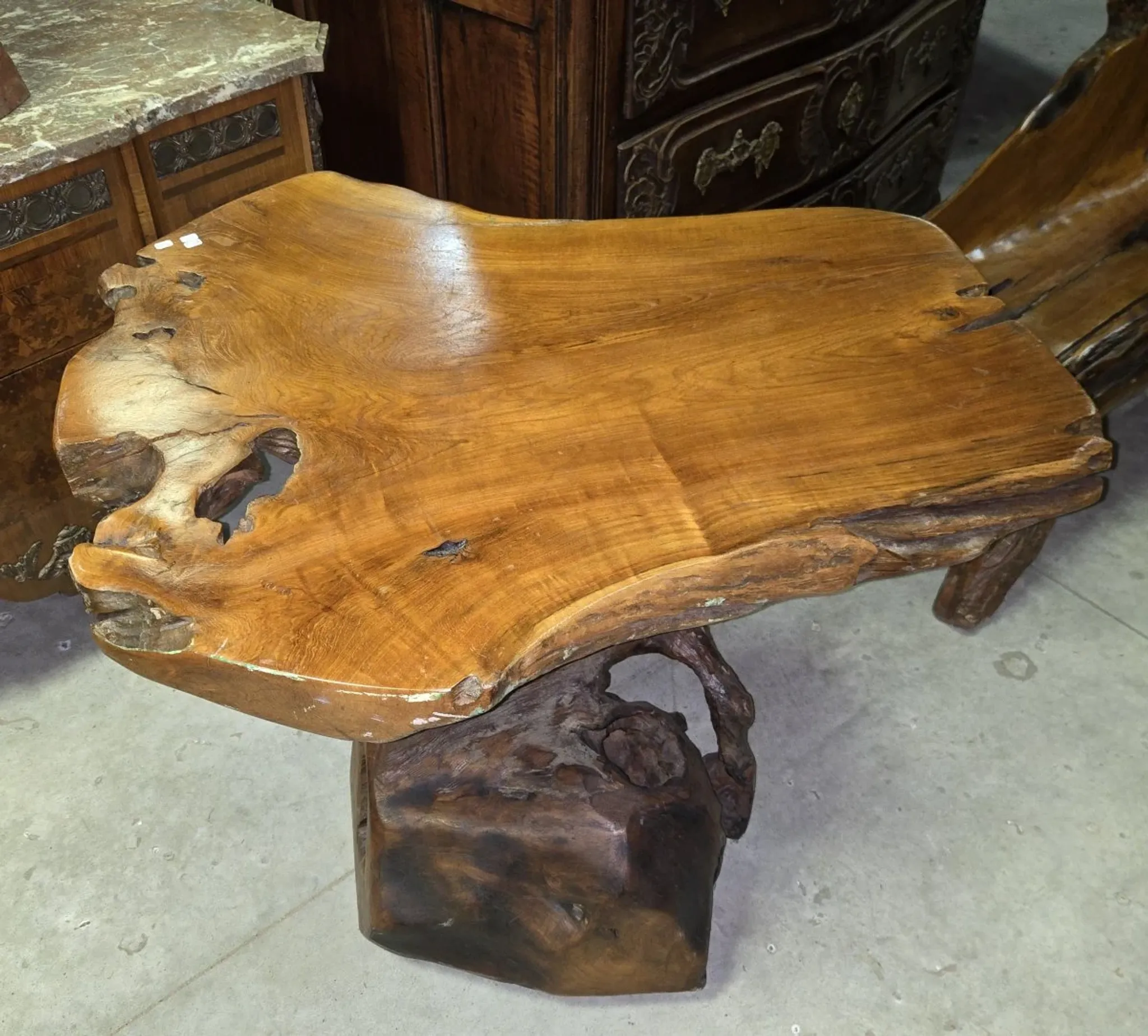 Sculpted olive wood table, made from a root.