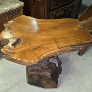 Sculpted olive wood table, made from a root.
