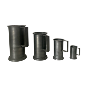 4 tin measuring jars