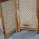 Handcrafted screen in exotic wood and rope.