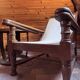 Vintage armchair in solid wood and geometric weaving – lodge spirit