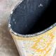 Oval paper bin in woven ochre and grey cotton