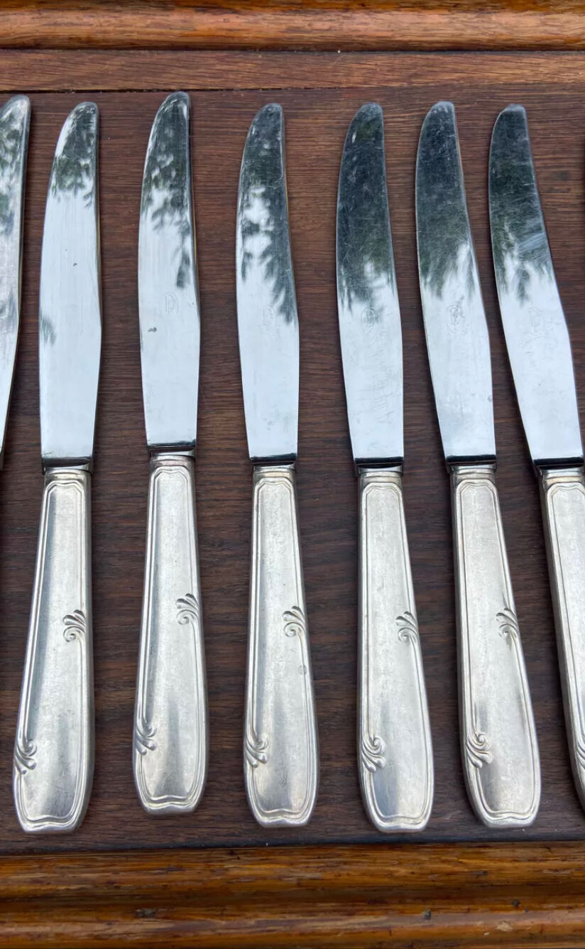 Set of 11 large silver metal knives