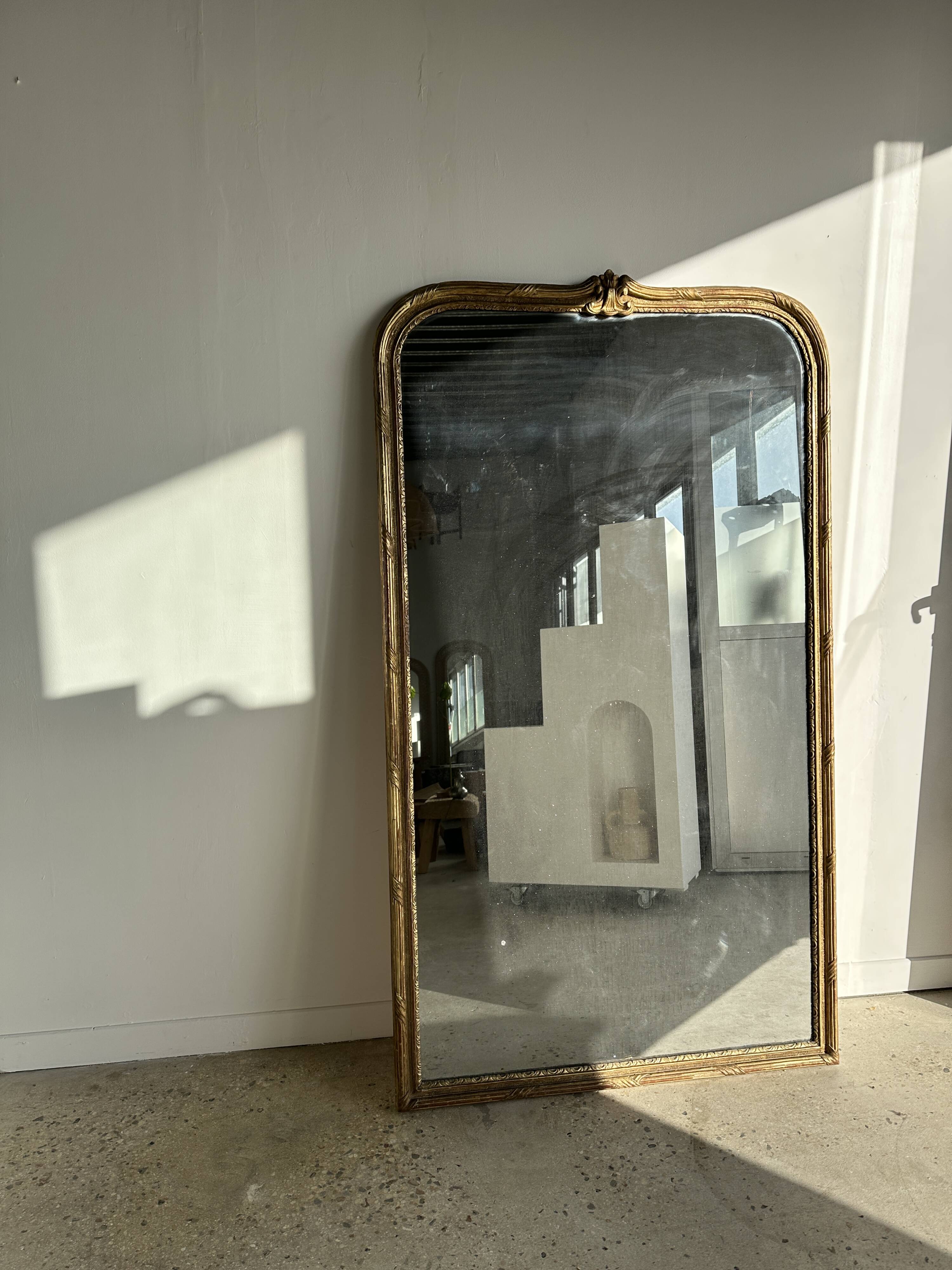 Large gilded mirror 19th century rounded corners mercury glass Louis XVI style