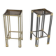 Pair of Hollywood Regency side tables in gold metal and smoked glass.