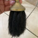 Vintage brass fireplace tool set with shell decoration.