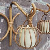Pair of Louis Sognot rattan wall lights.