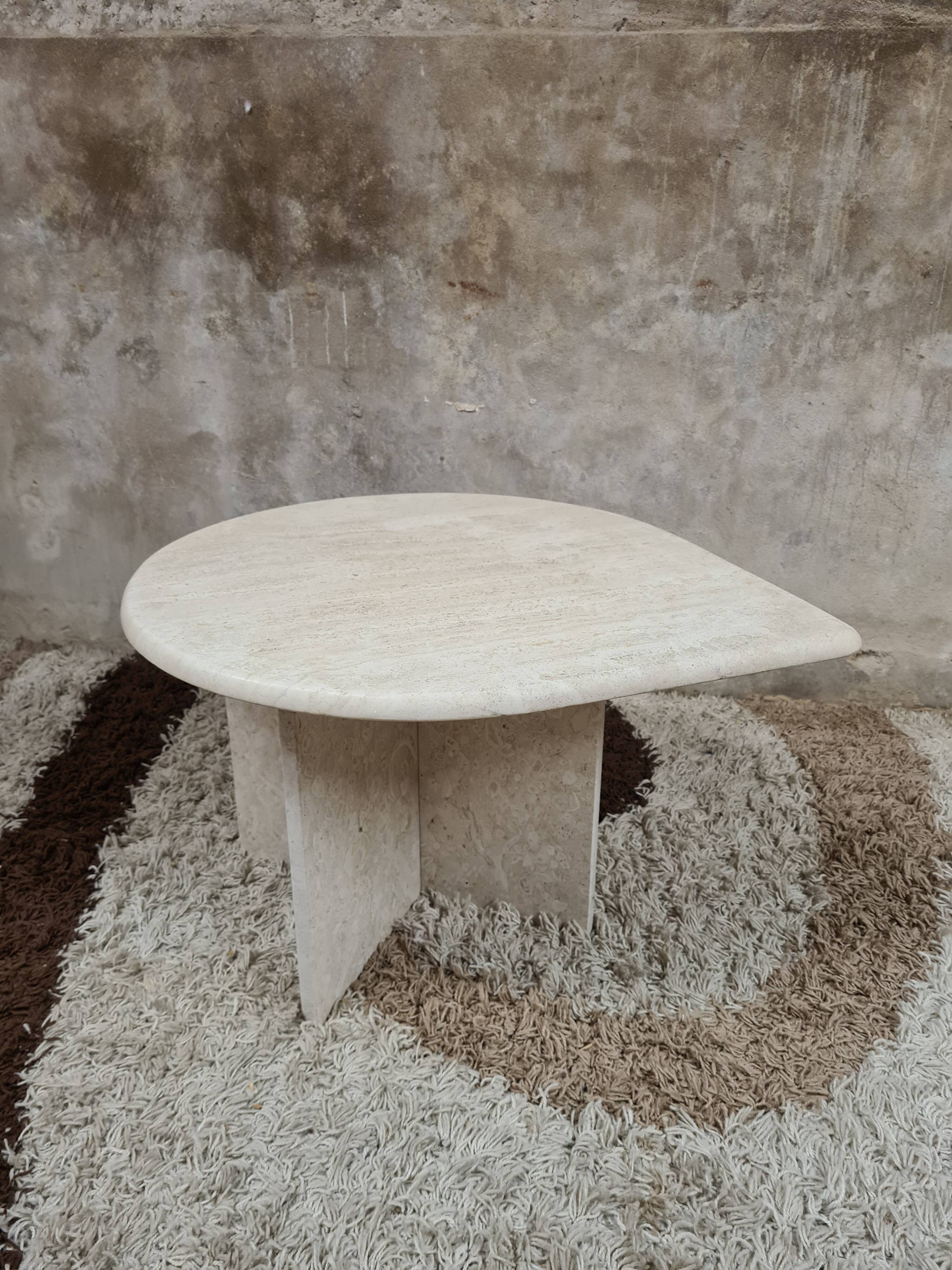 Travertine drop-shaped coffee table