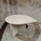 Travertine drop-shaped coffee table