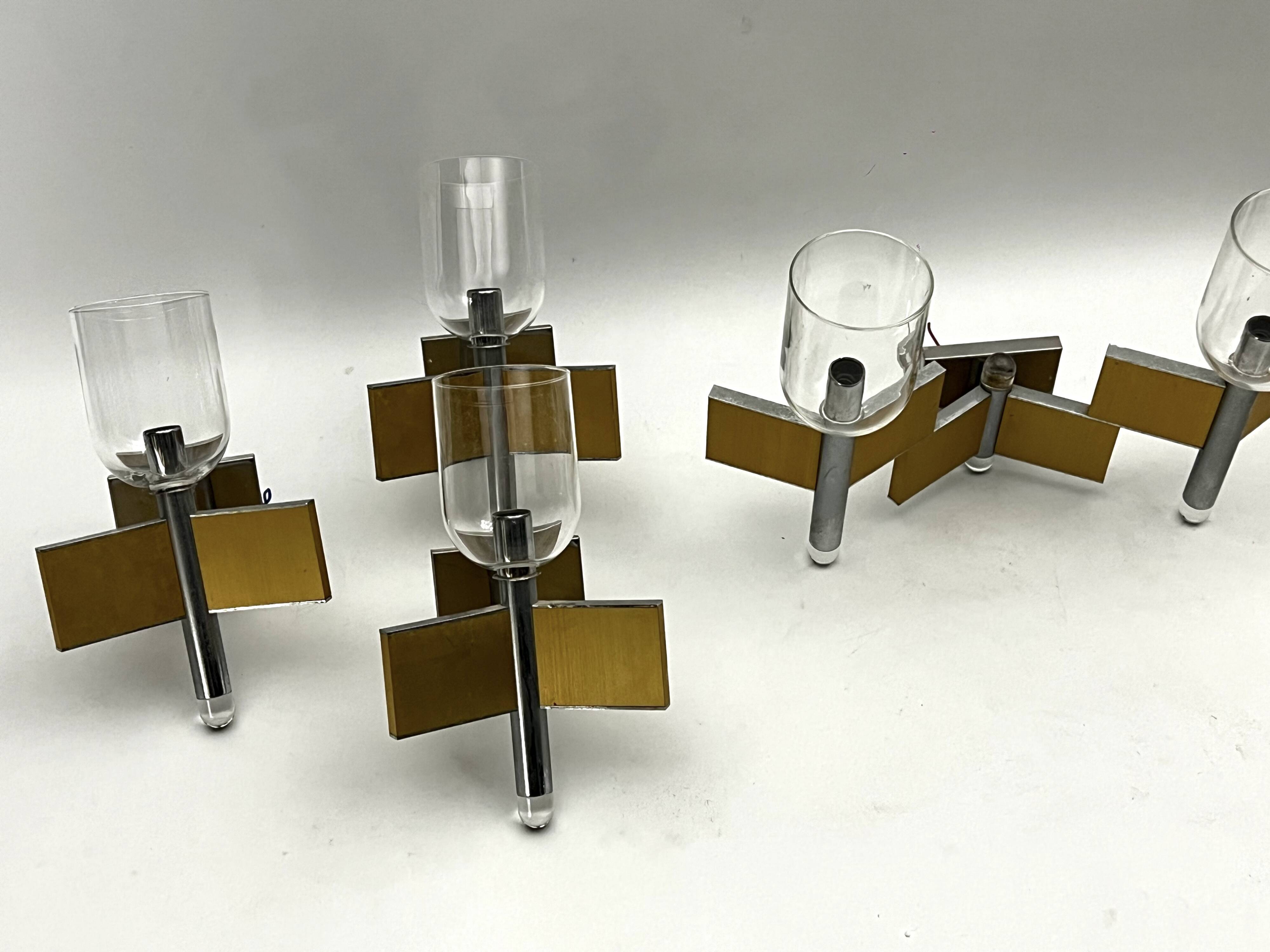 Mid-Century Modern set of eight brass and chrome sconces by Sciolari. Italy 1970s