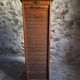 French antique wardrobe with curtain in oak, circa 1920–1930.