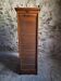 French antique wardrobe with curtain in oak, circa 1920–1930.