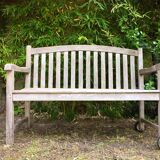 Vintage wooden garden bench with wheels
