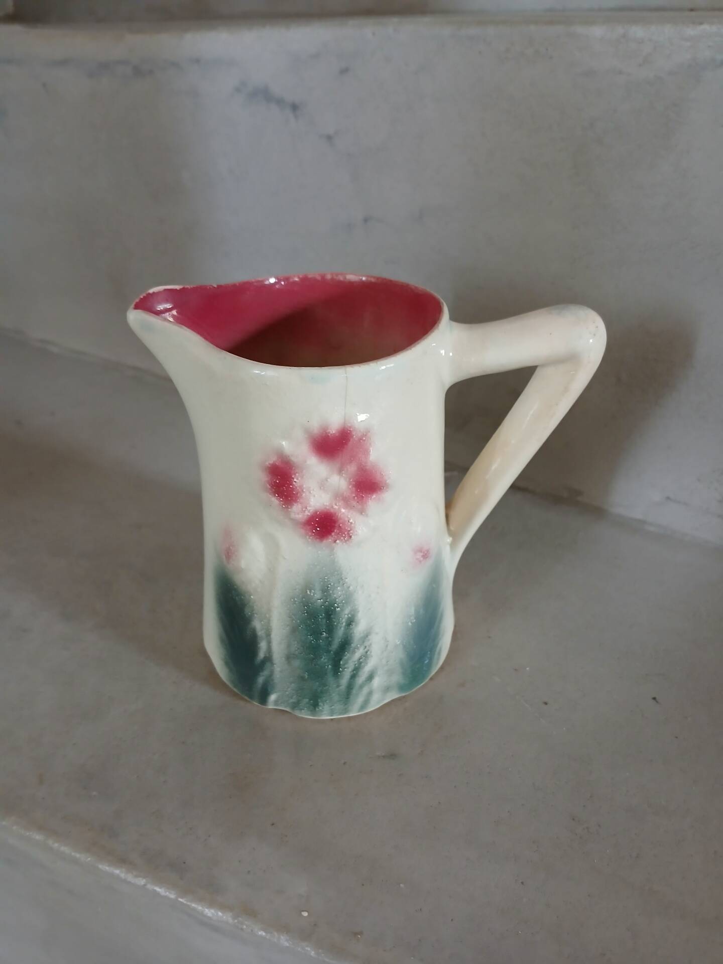 Small antique jug in slipware.