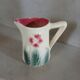 Small antique jug in slipware.