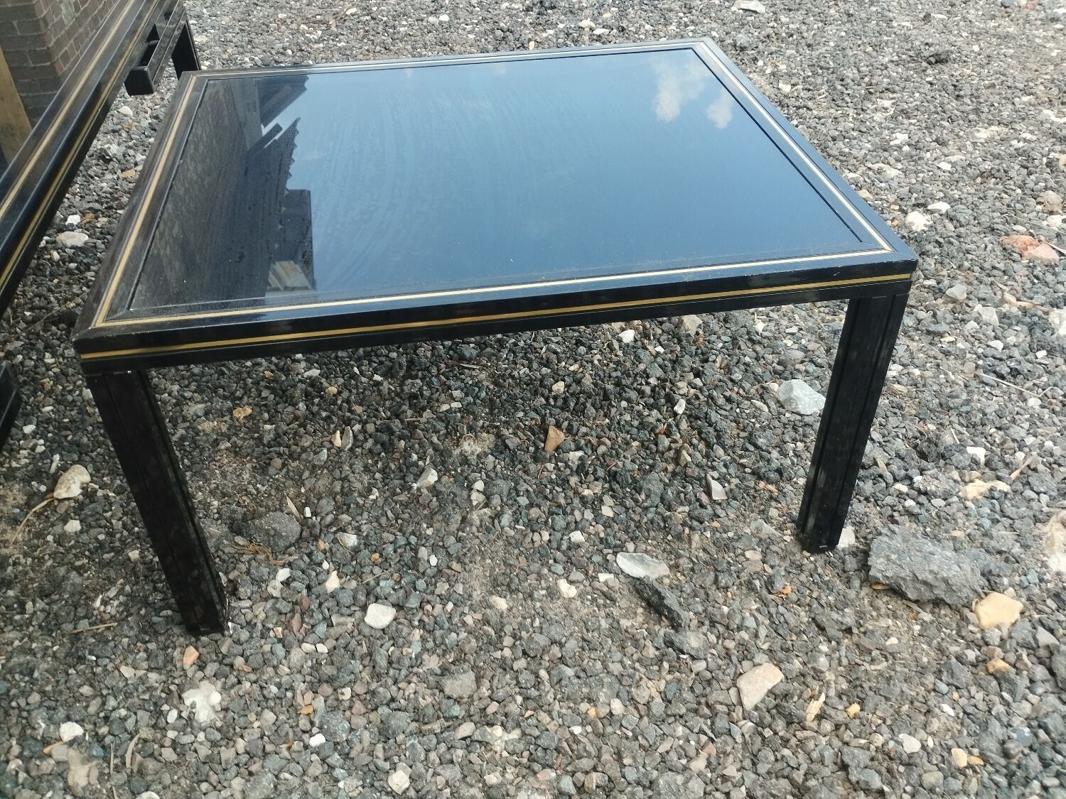 Vintage metal coffee table with glass top.