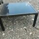 Vintage metal coffee table with glass top.