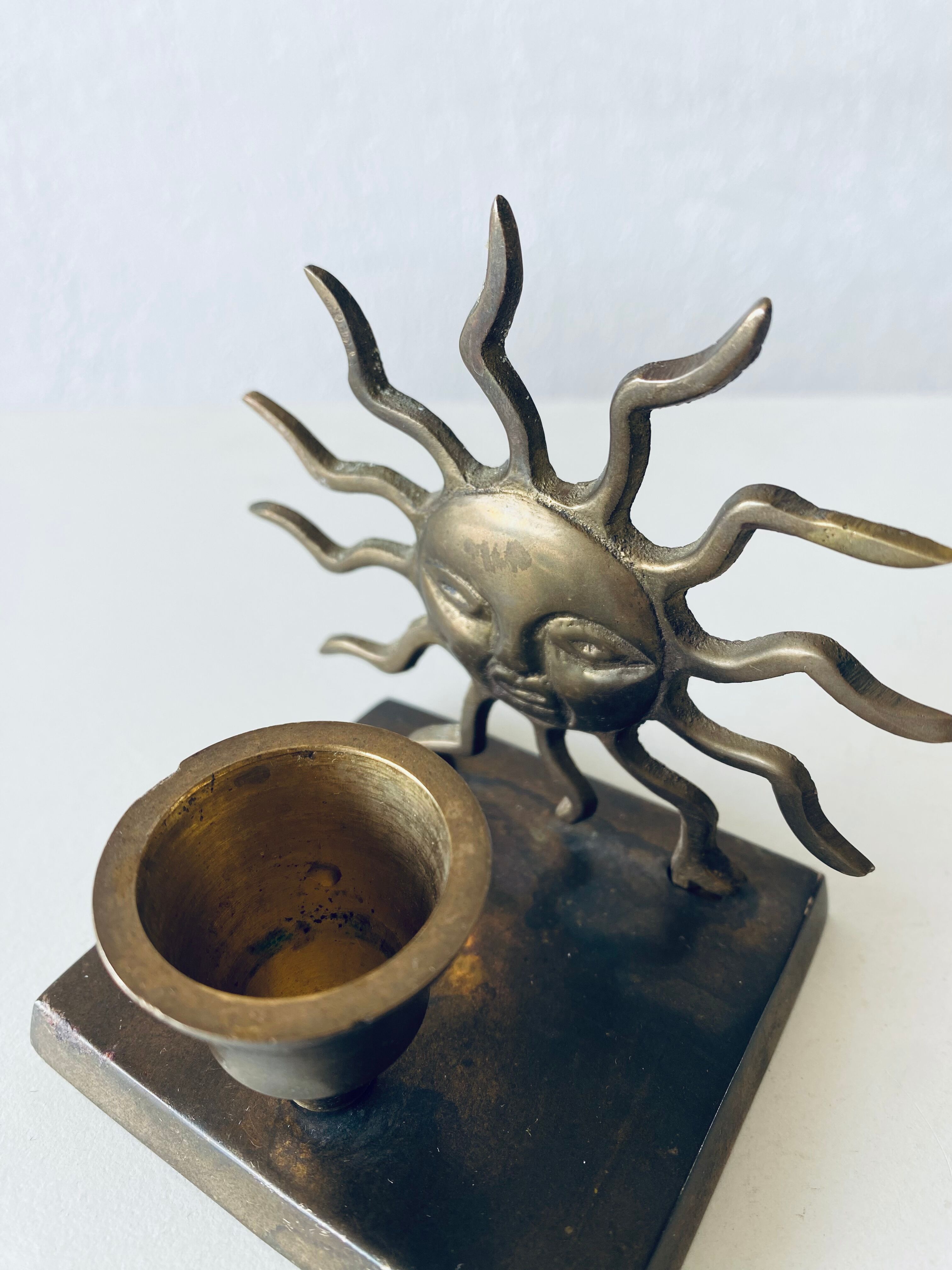 Pair of sun candle holders