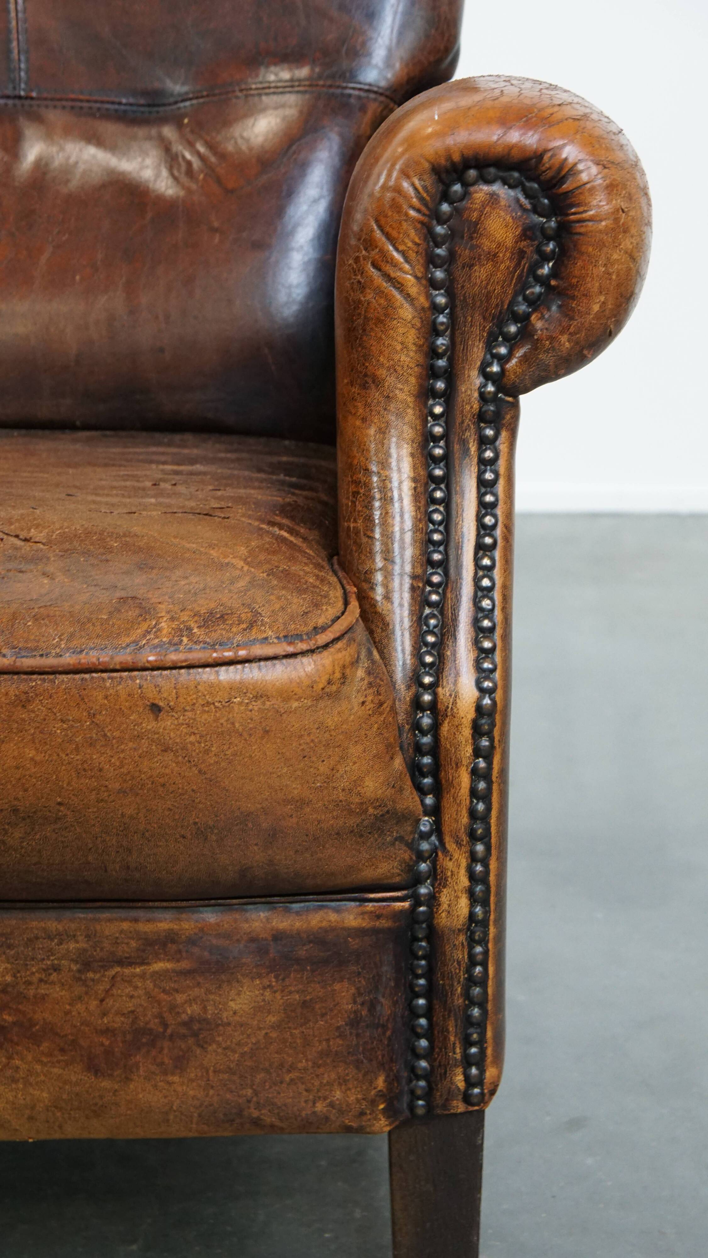 Fauteuil vintage en cuir de mouton avec dossier haut