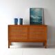 Scandinavian oak cabinet with woven rattan doors