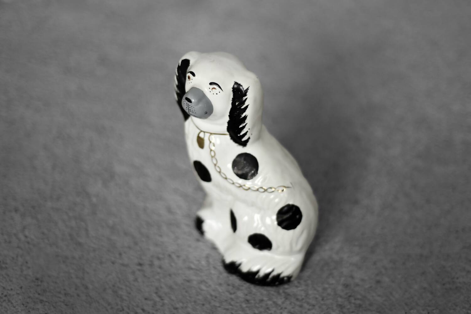 Vintage ceramic figurine from Staffordshire depicting a spaniel dog, England.