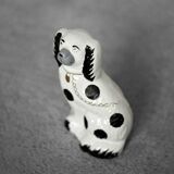 Vintage ceramic figurine from Staffordshire depicting a spaniel dog, England.