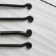 Set of 4 hammered metal cutlery with snail pattern.