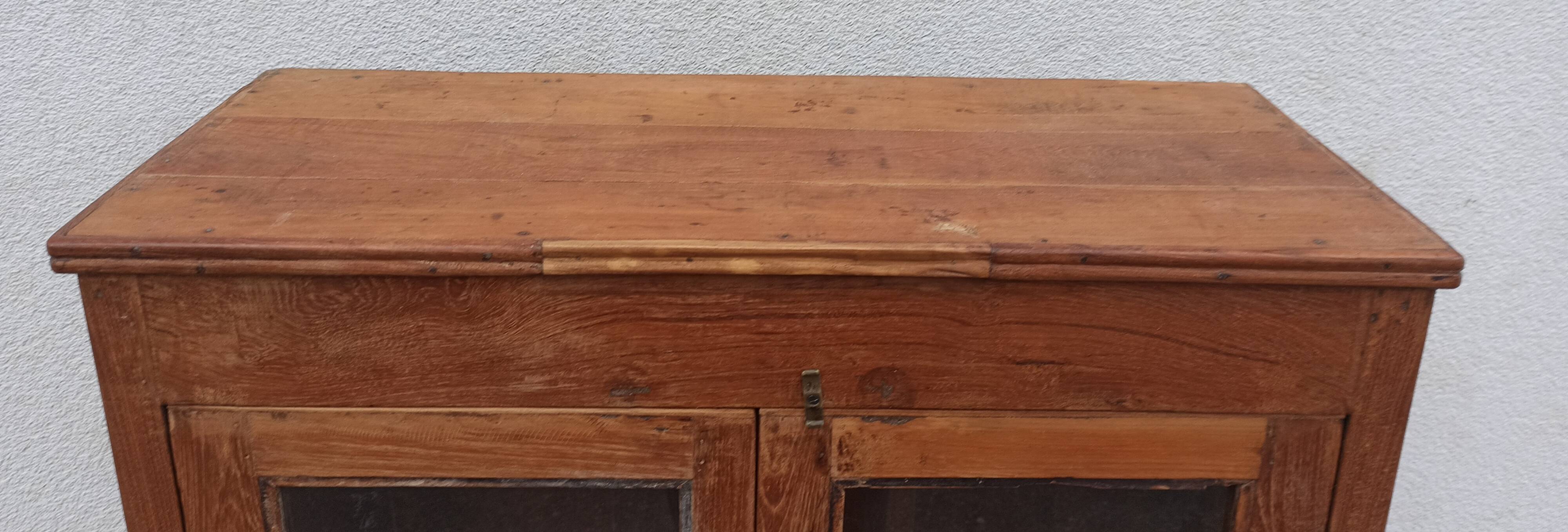 Old glazed teak cabinet