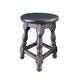 Antique wooden stool with turned legs.
