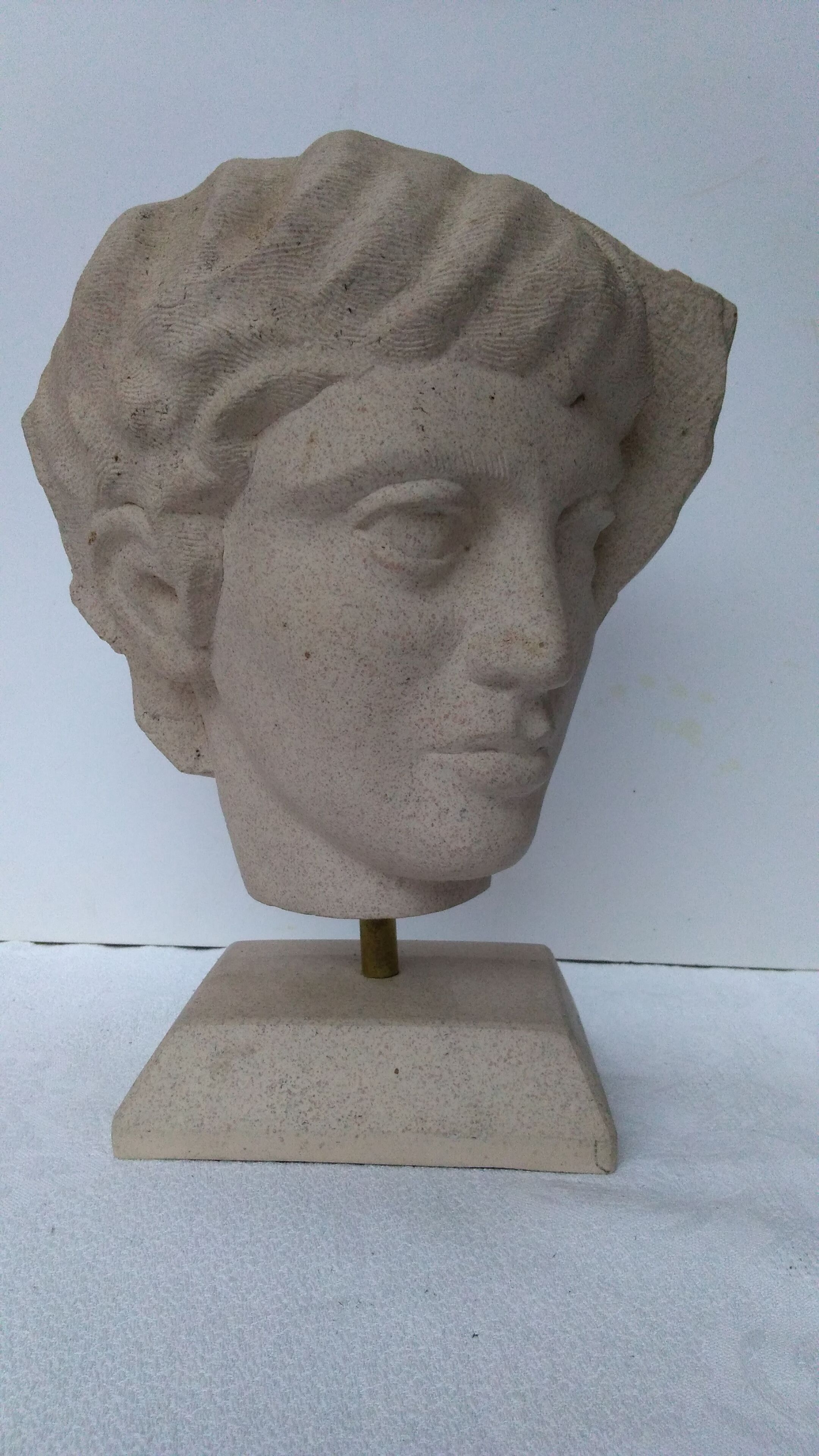 Ephebe head in sandstone