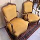 Pair of faux Louis XV armchairs in fully carved walnut