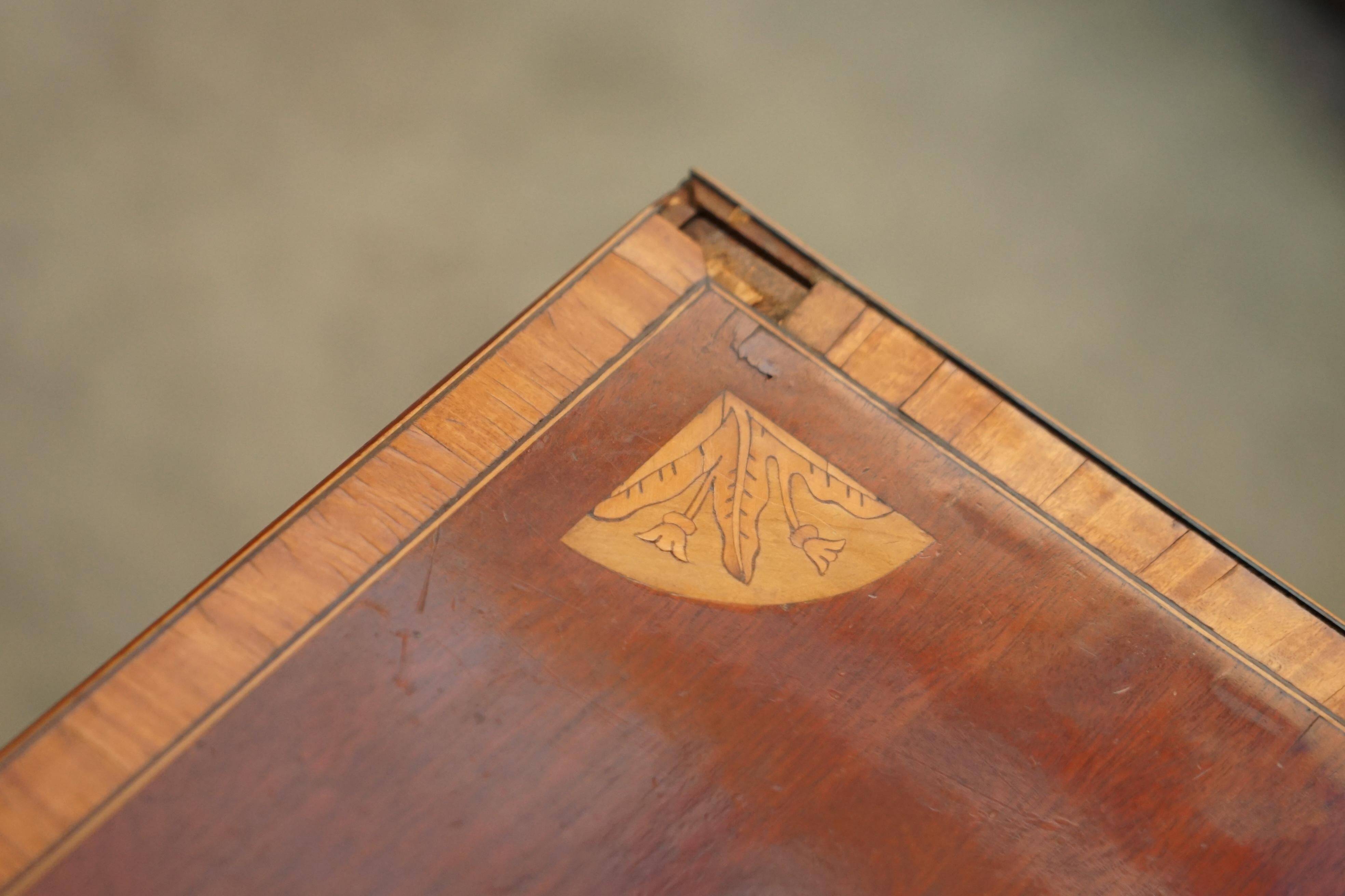 Antique Sheraton style commode by F. Thomas in hardwood and satinwood.