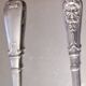12 small Christofle Marly silver-plated spoons in the mascaron pattern.