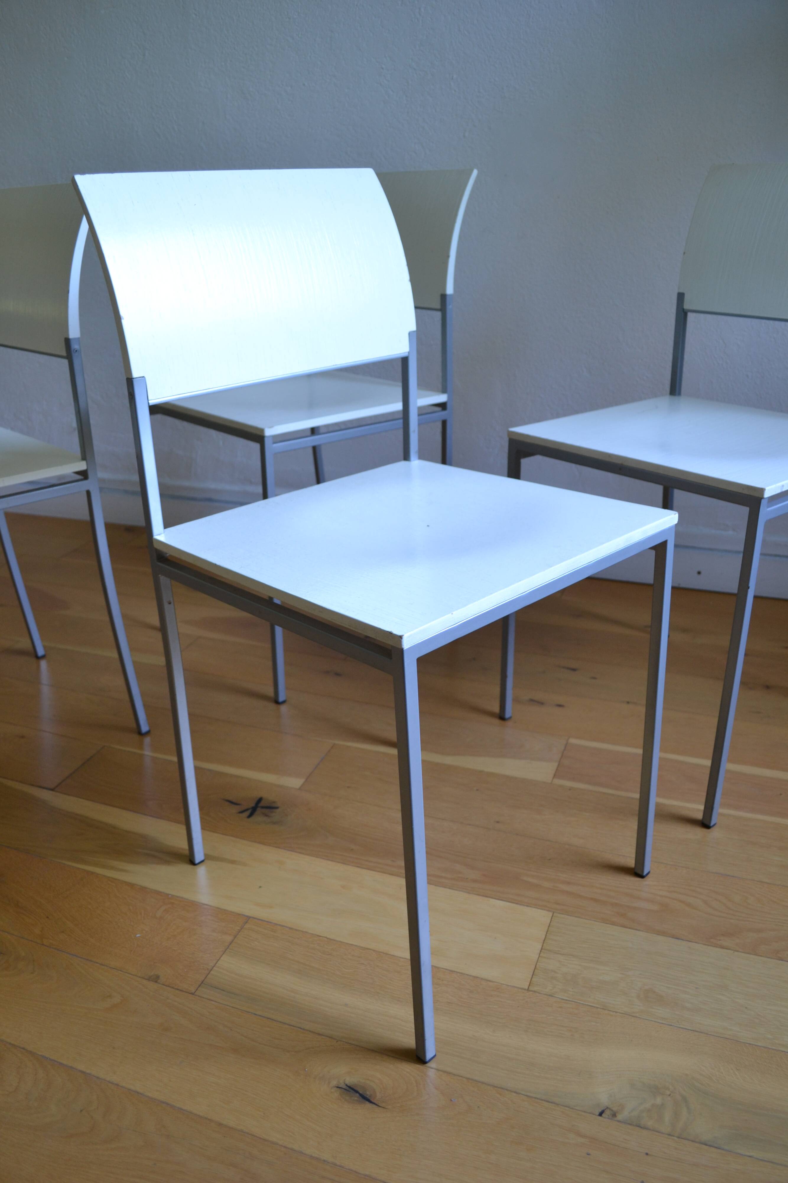 Set of 4 vintage metal and wood chairs from the 1990s.