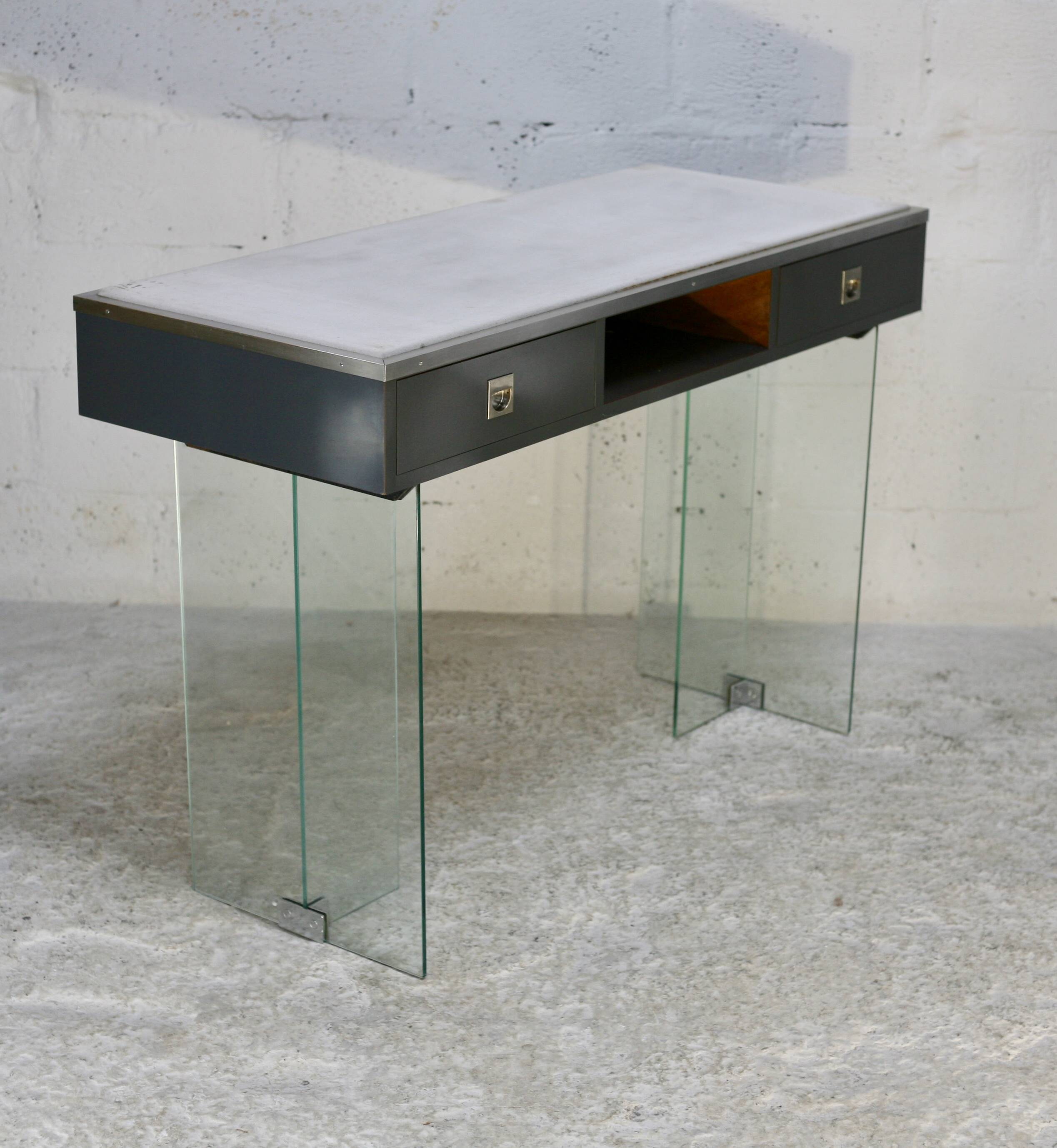 Modernist console, 1960s, glass base, wooden and fabric top.