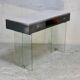 Modernist console, 1960s, glass base, wooden and fabric top.
