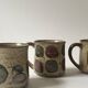 Set of 2 glazed ceramic coffee mugs from around 1970.