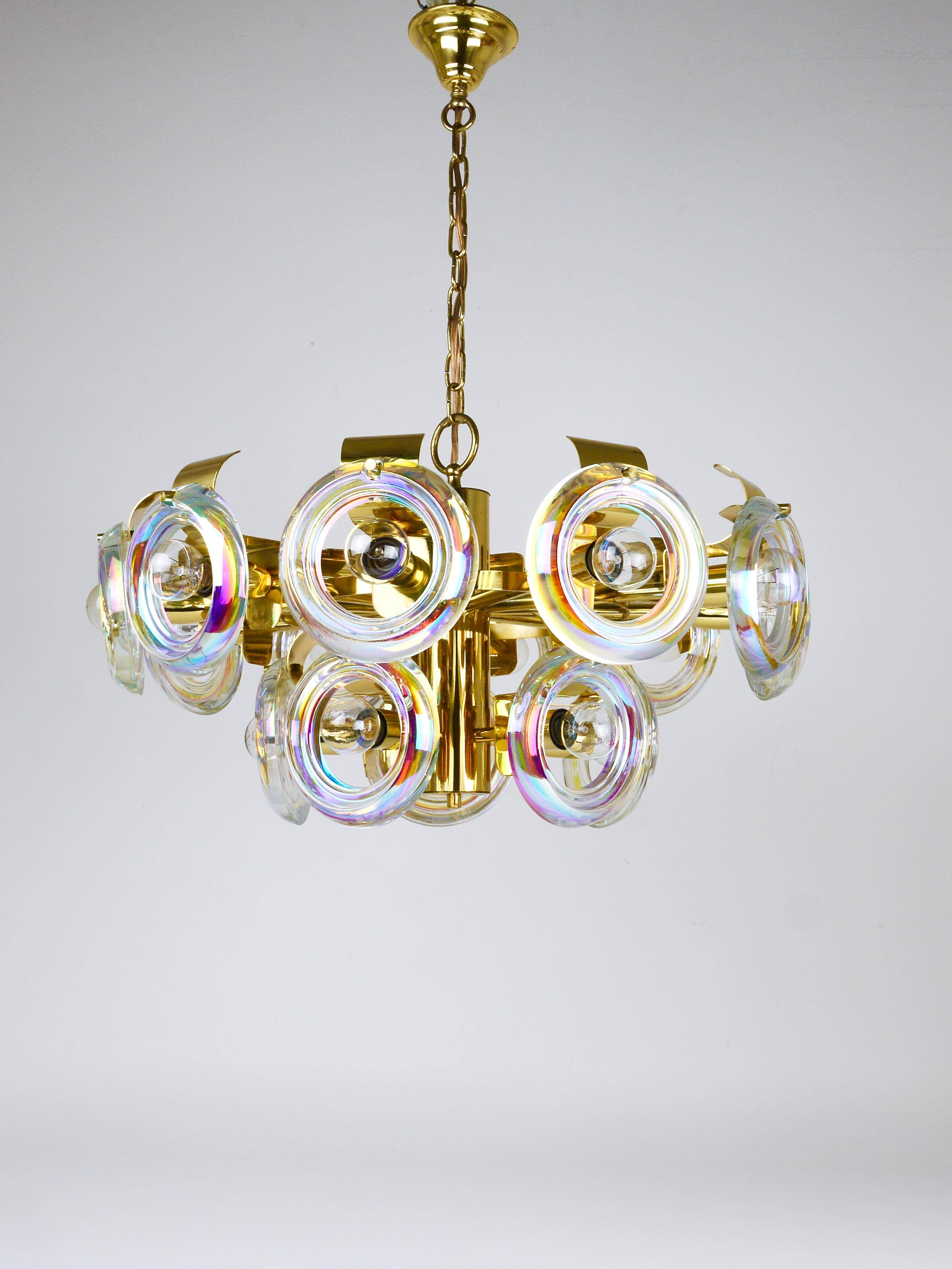 Large brass chandelier by Oscar Torlasco, rainbow optical glass rings, Italy, 1970s.