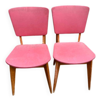 2 Scandinavian chairs in solid wood and burgundy leather from the 1970s.