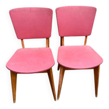 2 Scandinavian chairs in solid wood and burgundy leather from the 1970s.