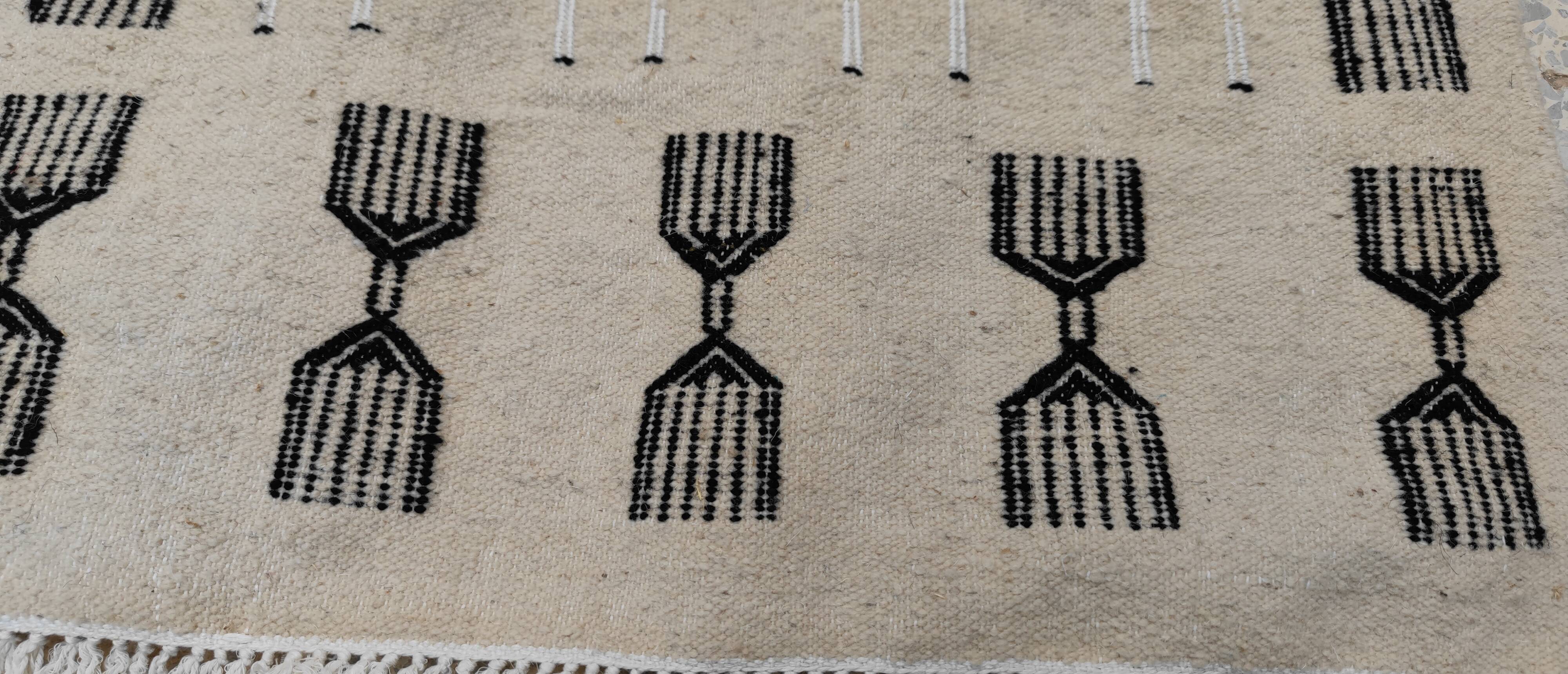 Handwoven kilim rug in natural wool