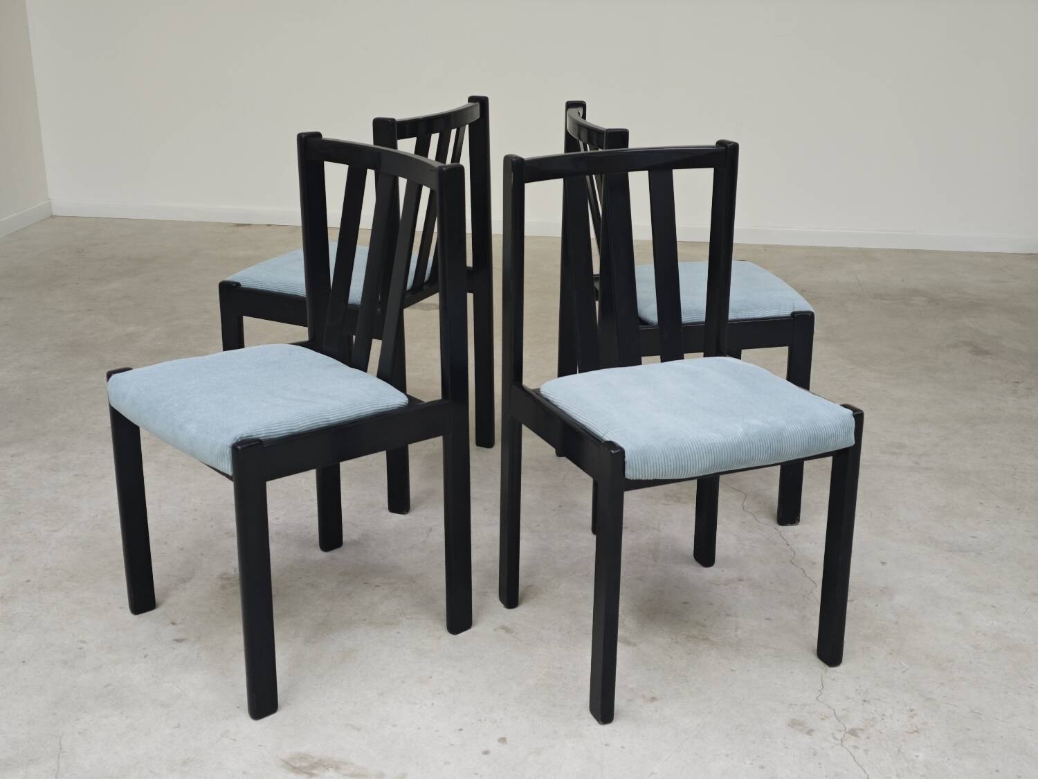 Set of 4 modernist black chairs with light blue ribbed fabric