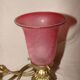 bronze bedside lamp with a pink cracked glass shade