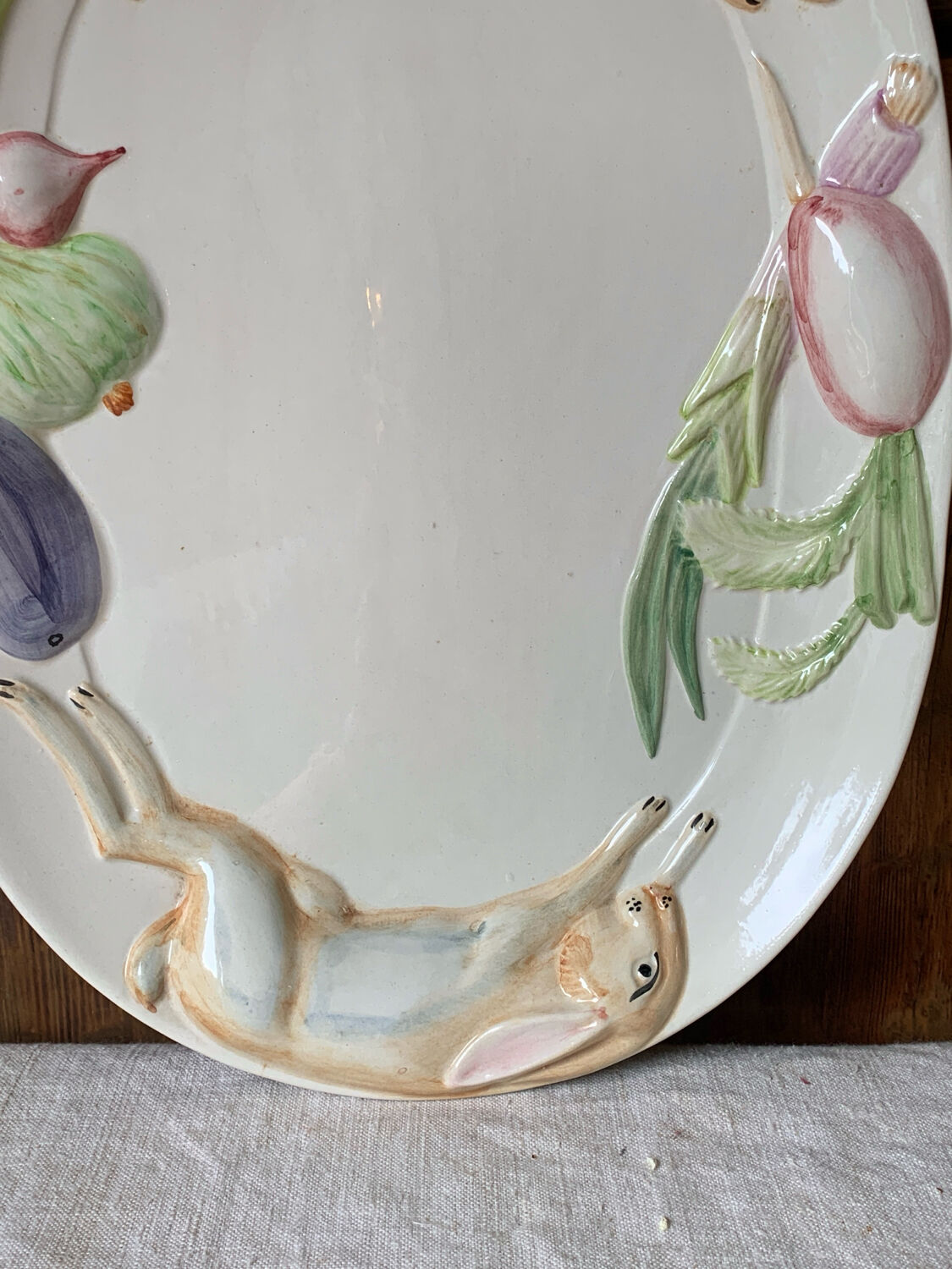 Very large serving dish with hares and vegetables.