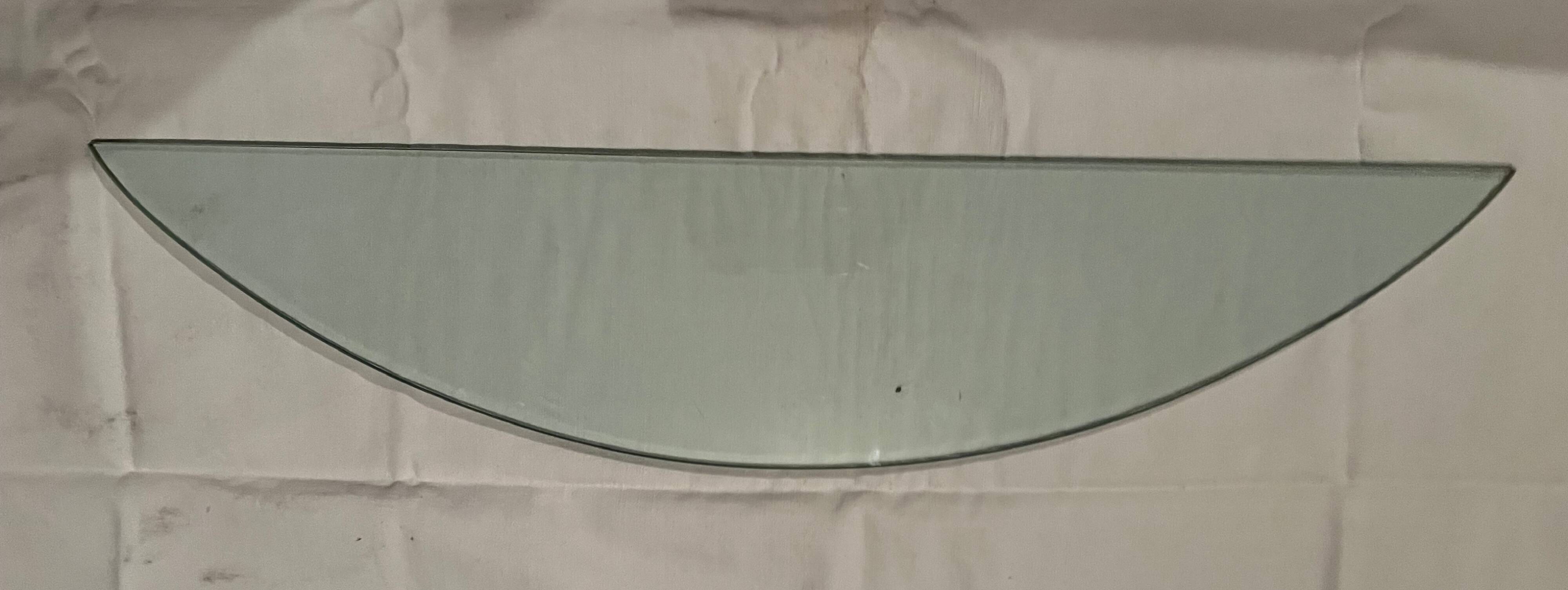 Console design in brushed steel and glass