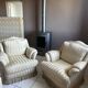 Pair of vintage bergère armchairs in striped ecru and beige fabric.